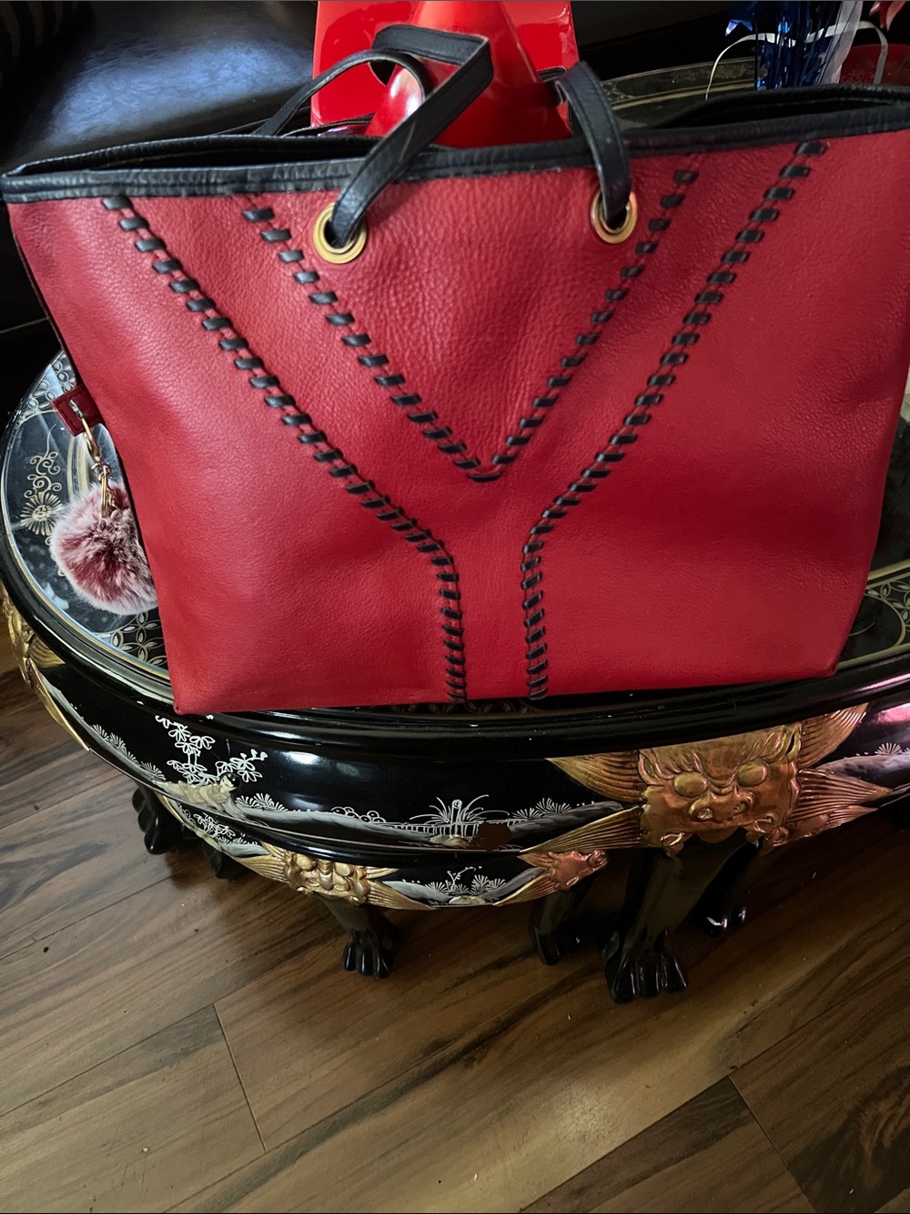 Red Leather Tote with Black Trim and Decorative Stitching